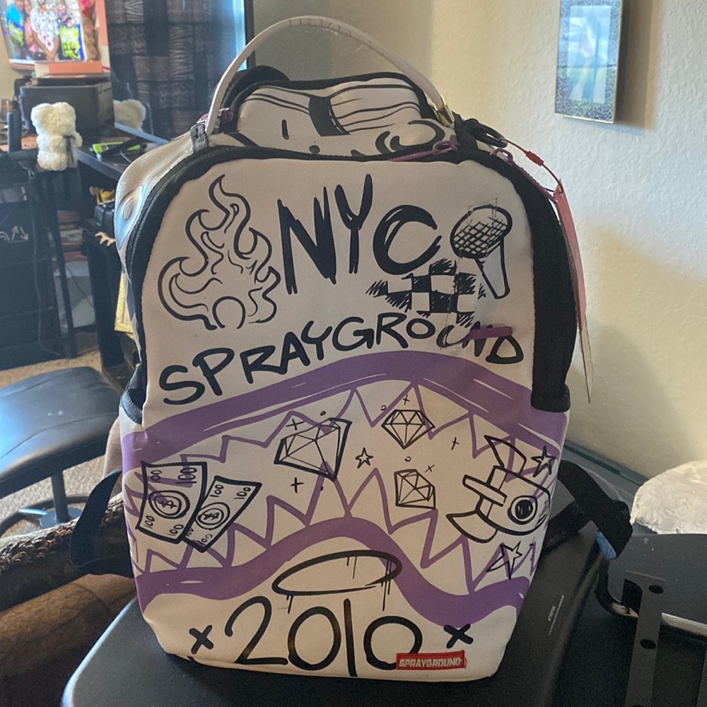 SprayGround Back Pack (Limited Edition) NYC 2010 Black, White and Purple.